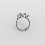 3 stone diamond ring on a light gray background