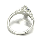 Silver ring with a large diamond on a white background