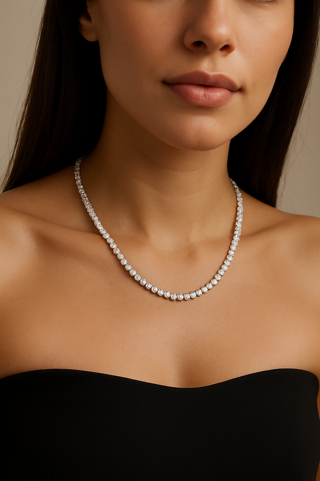 Diamond necklace worn by a model in a black dress against a neutral background