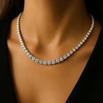 Diamond necklace in claw setting on a model against a black background