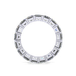 Silver ring with rectangular gemstones on a white background