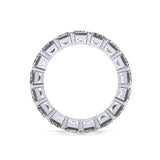 Silver ring with rectangular gemstones on a white background