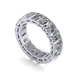 Platinum eternity ring with emerald-cut diamonds on a white background