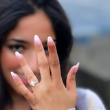 Marquise diamond ring on a ladies hand with black hair 