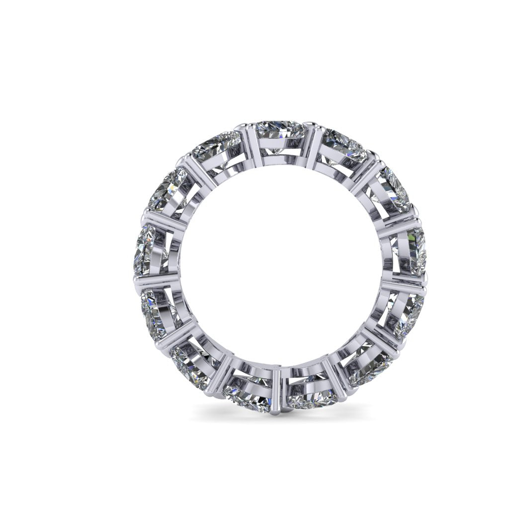 Diamond full eternity ring with heart shaped diamonds on a white background