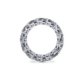 Diamond full eternity ring with heart shaped diamonds on a white background