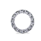 Diamond full eternity ring with heart shaped diamonds on a white background