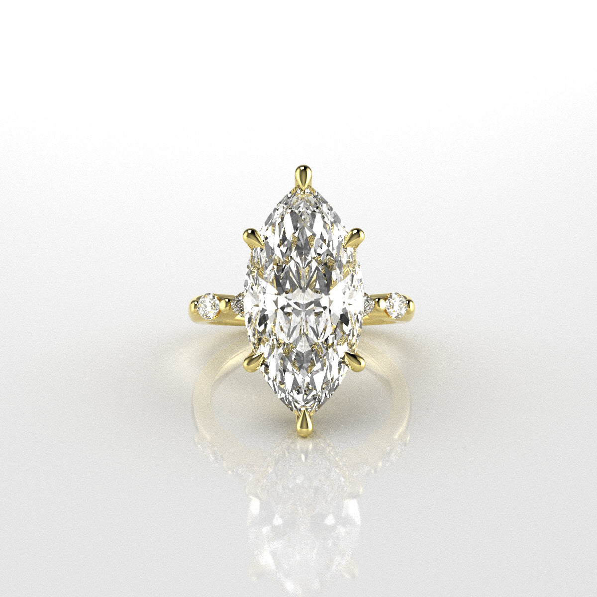 18k yellow gold ring with a marquise-shaped diamond on a white background