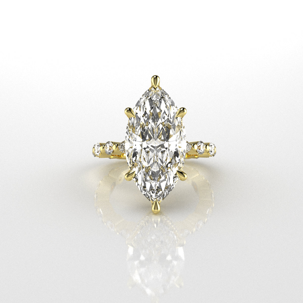 Gold ring with a marquise-shaped diamond with 6 claws on a white background