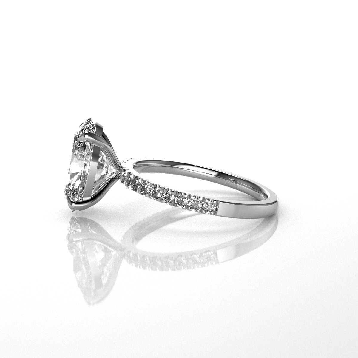 Diamond ring with oval shaped diamond centre stone with a floating collet on a white background