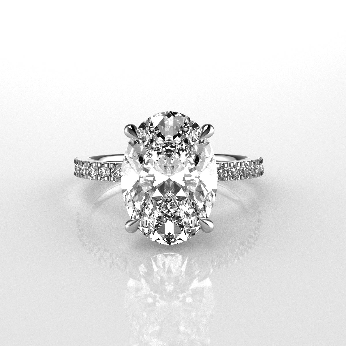 Diamond ring with a large central oval diamond with diamonds on the band on a light gray background