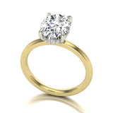 Gold ring with an oval diamond on a white background