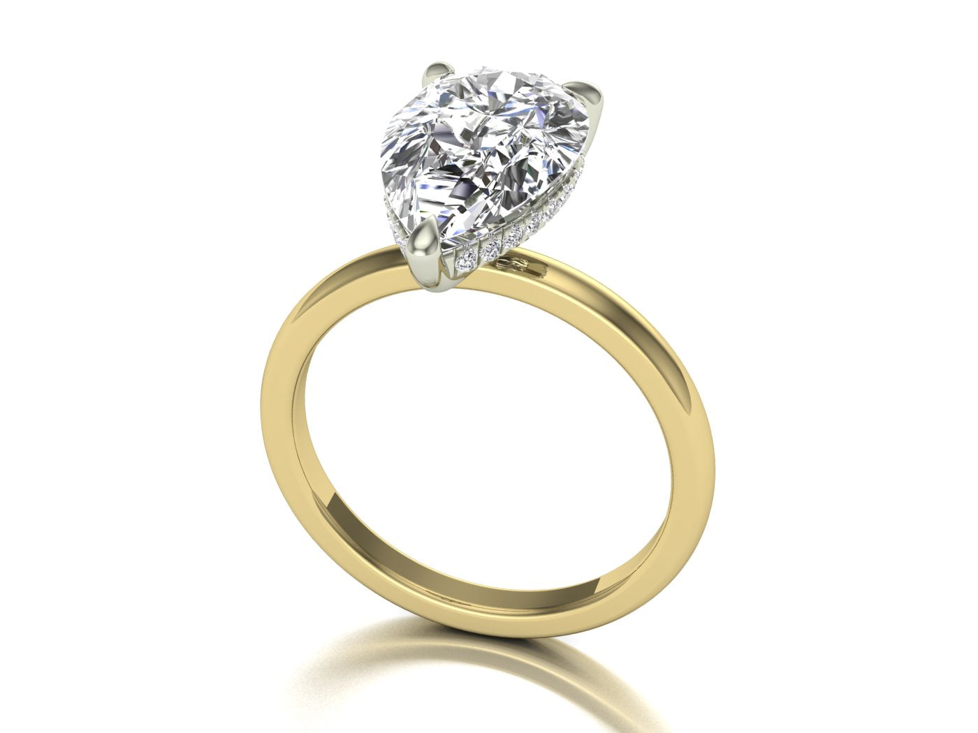 18k gold ring with a pear-shaped diamond on a white background