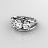 Platinum ring with three round brilliant cut diamonds in prong setting with double bar style ring on a reflective surface