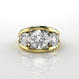 18k yellow gold ring with three round brilliant cut diamonds in claw setting with double bar style ring on a reflective surface