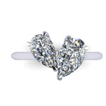 Pair of pear shaped diamond in a platinum ring on a white background