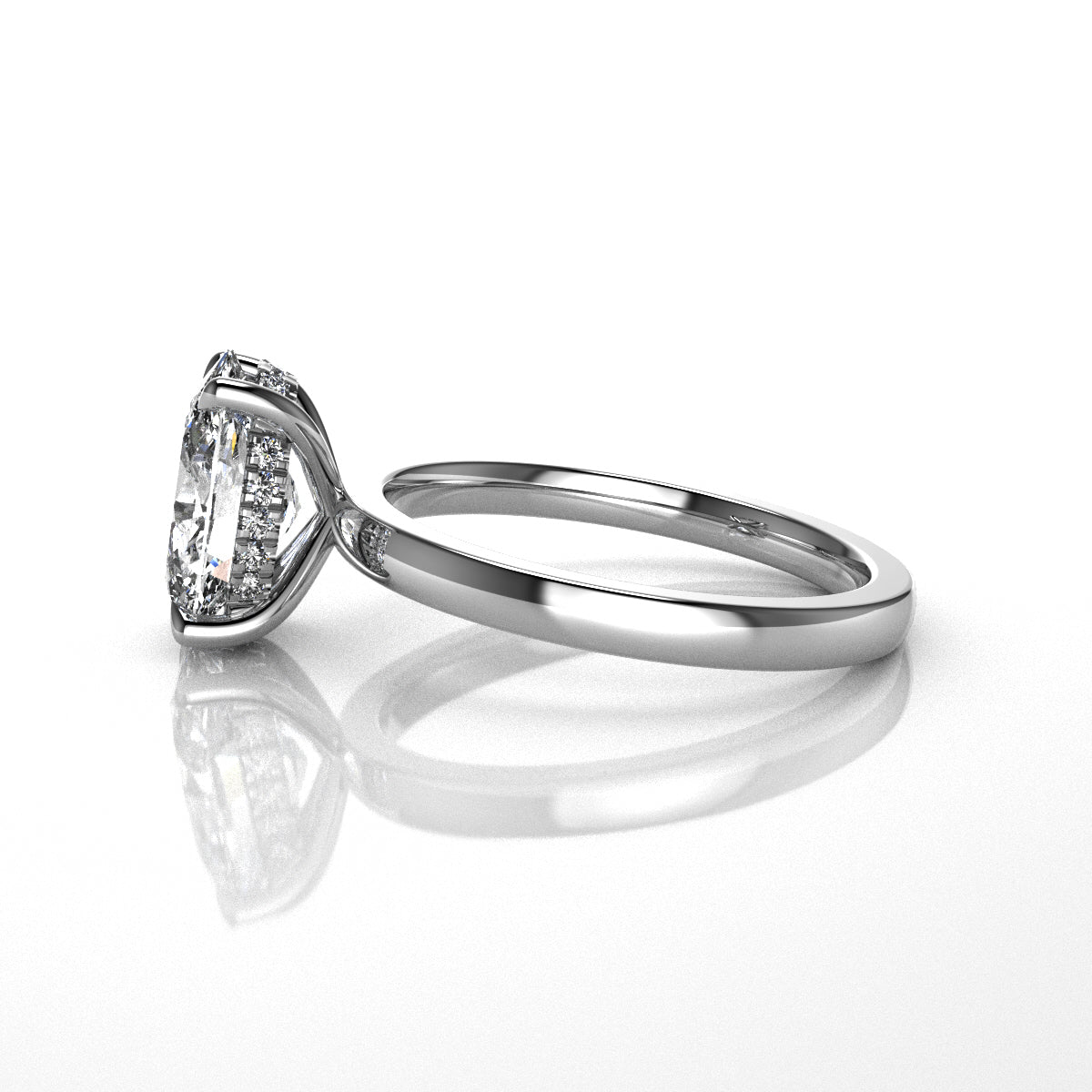Platinum ring with a large diamond and diamond set hidden halo on a white background