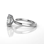 Platinum ring with a large diamond and diamond set hidden halo on a white background